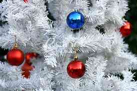 White Christmas tree with colorful ornaments