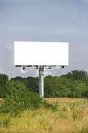 Empty billboard on background of sunset sky