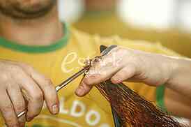 Closeup of hairdresser cutting hair