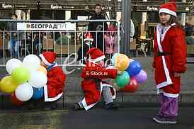 People in Santa Claus costumes take part in the race