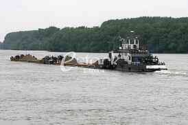 push boat Barge pushed by towboat on the river freighter ship with sand