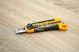 A box cutter isolated against a table background