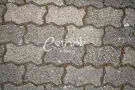 The fragment of a pavement footpath Paving stone with holes