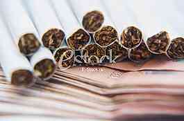 Thousand dinars bills and cigarette