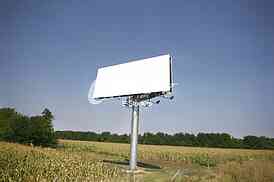 Empty billboard on background of sunset sky