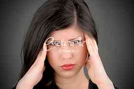 woman in pain holding her head