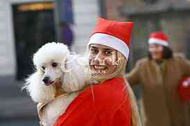 People in Santa Claus costumes take part in the race