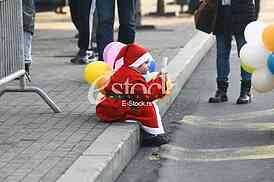 People in Santa Claus costumes take part in the race