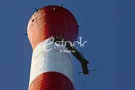 Heat and power central, smoke pipe against clear blue sky