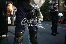 Police officer is holding with a rifle