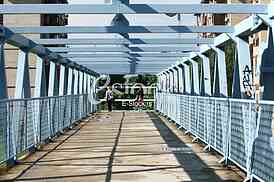 a metal bridge in blue, gangway pedestrian footbridges