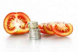 Tomato vegetables pile isolated on white background cutout with coins