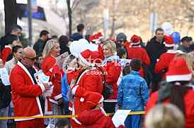 People in Santa Claus costumes take part in the race