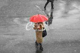 Girl with umbrella during snow storm