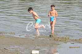 Childern on the beach strand enjoy the Spring sunny day