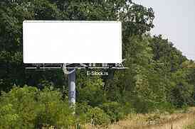 Empty billboard on background of sunset sky