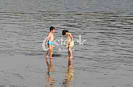 Kids on the beach Strand enjoys the Spring sunny day