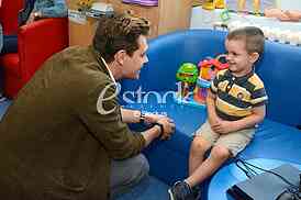 actor Milos Bikovic spending time with children at the Department of Oncology