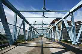 a metal bridge in blue, gangway pedestrian footbridges