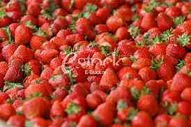 Strawberry fresh natural juicy strawberries to background on the street market
