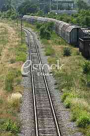 Cargo train platform railway tracks in a rural scene, Empty railway containers for transportation covered with a rust