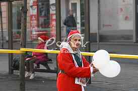 People in Santa Claus costumes take part in the race