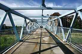a metal bridge in blue, gangway pedestrian footbridges