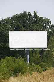 Empty billboard on background of sunset sky