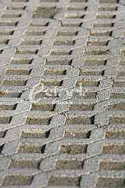 The fragment of a pavement footpath Paving stone with holes
