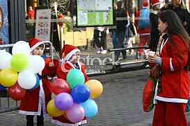 People in Santa Claus costumes take part in the race