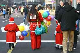 People in Santa Claus costumes take part in the race