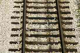 Cargo train platform railway tracks in a rural scene