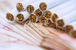 Thousand dinars bills and cigarette
