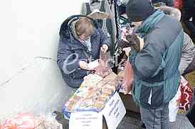 Preparing fish for eating.