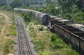 Cargo train platform railway tracks in a rural scene, Empty railway containers for transportation covered with a rust