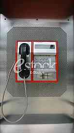 the public pay phone close up, phone and headset